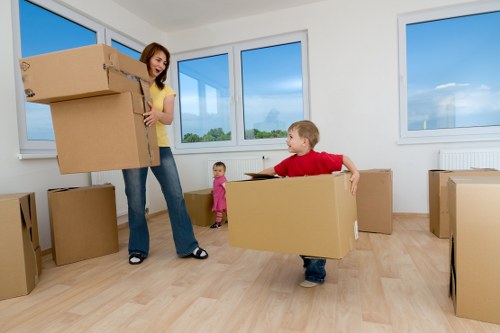 Prepared storage unit with labelled boxes and covered furniture for long-term keeping