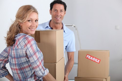 Local Uxbridge customers loading packed boxes into a storage unit