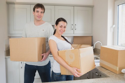 Carefully wrapped sofas and household furniture prepared for storage